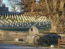 The cemetery's south end contains graves of soldiers from more recent wars. The back of the Lincoln Address Memorial is at upper left.