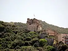 Ruins of stone castle on a hillside