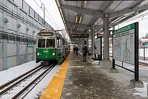 A light rail station under construction in a below-grade rail cut