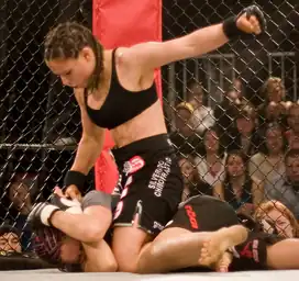 Image 35Gina Carano applying a ground-and-pound on her opponent. (from Mixed martial arts)