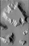 Mesa in Ismenius Lacus quadrangle, as seen by CTX. Mesa has several glaciers eroding it. One of the glaciers is seen in greater detail in the next two images from HiRISE.  Image from Ismenius Lacus quadrangle.