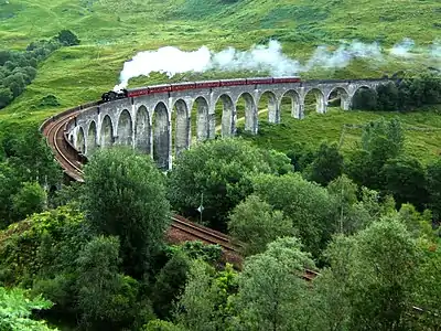 Image 21Glenfinnan Viaduct is a railway viaduct on the West Highland Line in Glenfinnan, Lochaber, Highland. It was built between 1897 and 1901. Located at the top of Loch Shiel in the West Highlands, the viaduct overlooks the Glenfinnan Monument and the waters of Loch Shiel.Photo credit: Nicolas17