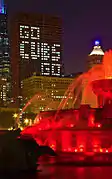 CNA's building with wording formed by office lights through windows "Go Cubs Go".