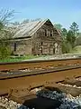 The old barn near the railroad crossing was, perhaps, Gold Hill, Alabama's most recognizable landmark until it was torn down in 2010.