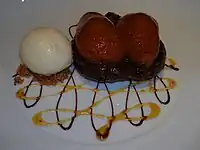 A Tarte Tatin with a chocolate and caramel sauce decoration