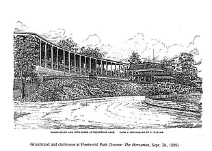 Black and white illustration showing the grandstand with a row of supporting columns, raised on an earthen embankment above a curved section of the track.  In the background is the clubhouse, with striped awnings.