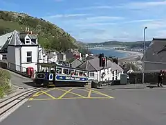 Tram descends across Ty Gwyn Road into Old Road