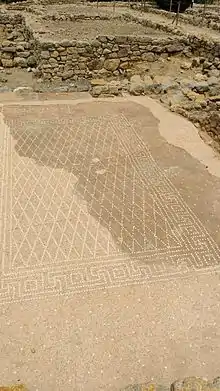 A mosaic in the Neapolis.  The Greek word "Ηδύκοιτος" ("the pleasure of lying down") is at the top.