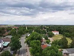 View from the Battle of Großbeeren Memorial Tower, north towards the village church. Berlin's skyline in the background.