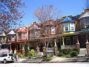 Image 1Some of the more upscale rowhouses in Baltimore, like these brightly painted homes in Charles Village, have complete porches instead of stoops (from Culture of Baltimore)