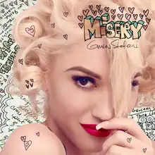 Stefani is shown with her left hand touching her mouth and tugging on her bangs; the background consists of the song's handwritten lyrics while the song's title is surrounded by hearts and appears in the upper right hand corner