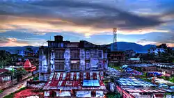 Picture of buildings in Lalganesh. The Nilachal Hill can be seen in the backdrop.