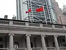 The Hong Kong flag and the national PRC flag flown side by side at the patio of the former Legislative Council Building