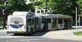 An articulated bus making a turn.