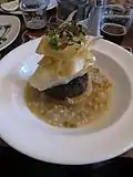 Haggis with neeps and tatties (mashed turnips and potatoes) in a whisky and barley broth. This dish was also served with a "wee dram" of Bell's Whisky on the side.