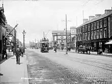 Circa 1907 with an electric tram near the Northern Counties Committee station  at York Road railway station.