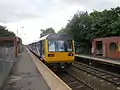 A Northern Rail Class 142 at the station.