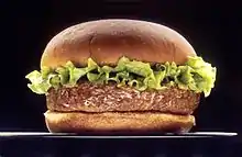 A picture of a hamburger with three buns