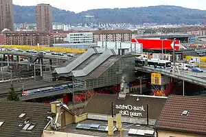 Railway station under the bridge, and tram/bus stop on the bridge