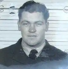 Black and white portrait photograph of a young man