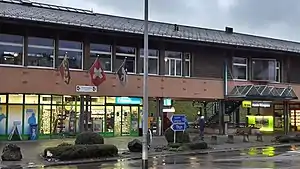 Wide two-story building with gabled roof