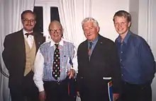 Povel Ramel (second from left) and Hans Alfredson (second from right) being hosted by a student association at Lund University in 1999