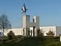 Rooster on a roundabout statue