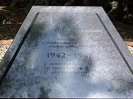 "Black marble slab inscribed with the legend 'Burma-Thailand Railway 1942-1945. In remembrance of all who suffered and all who died.'"