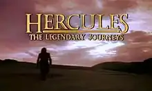 A darkened mountainous scene with dark clouds overhead. A lone man is standing to the left of the scene. Above the scene in golden capital letters is the title of the show.