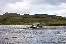 Crossing a river in Iceland Highland