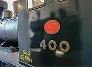 The builder’s plate and cab side of Sk3 400 at the Finnish Railway Museum