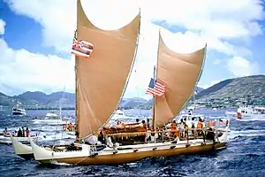 Hokule'a, a bluewater waʻa kaulua, with curved-spar, curved-leech crab claw sails, in 1976.