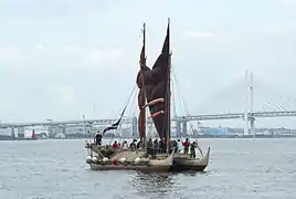 Hokule'a with her kaula pe'a (sail lines) tightened to partly close her crab-claw sails.