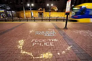 Chalk graffiti on the platform during the Trial of Derek Chauvin in the murder of George Floyd.