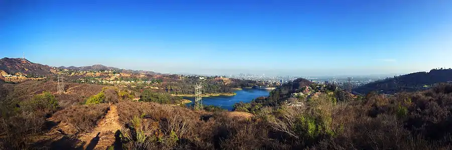 The Hollywood Reservoir and the Mulholland Dam, with the Hollywood Sign in the distance to the left (2015)