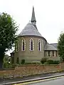 Holy Trinity Church, Lyonsdown Road, New Barnet, London, 1865 by Ewan Christian, showing the strong chancel apse in stock brick with red brick banding