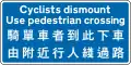 Cyclists must dismount and use crossing to cross the road