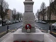 Black lettering inscribed on smooth stone