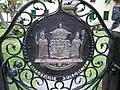 Coat of arms on the gate of the Huliheʻe Palace.