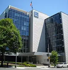 A 9-story building with an "=" logo at the top and sign in front reading "Human Rights Campaign"