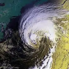 Satellite imagery showing a poorly-formed hurricane at its strongest northwest of Bermuda