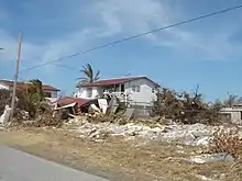 A house with part collapsed in Freeport, Bahamas