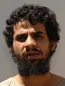 Mohammad Al Rahman Al Shumrani's identity portrait, showing him wearing the white uniform issued to white uniform individuals.