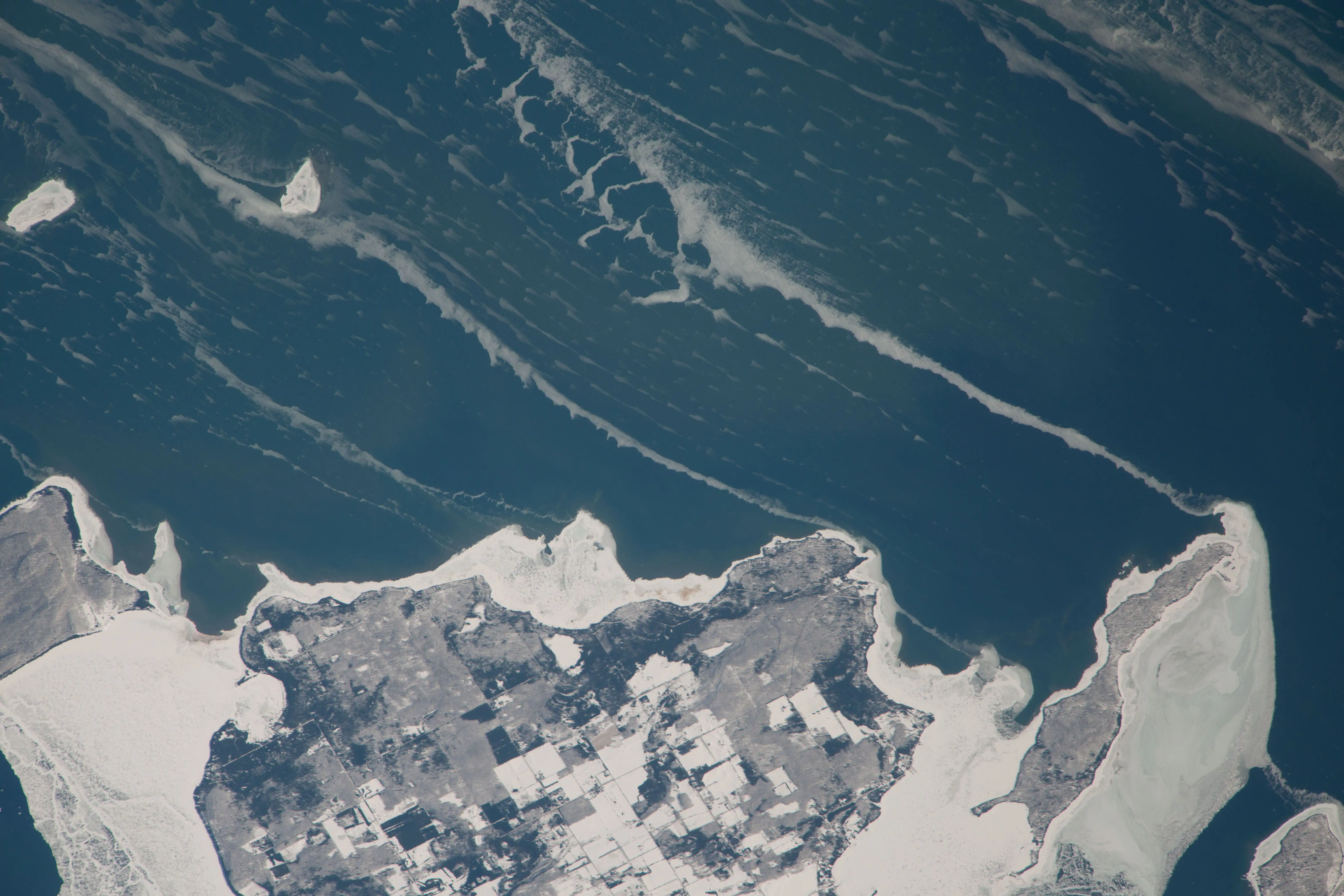 February 22, 2014; Hog island and its reefs stand out in the lake ice, with the average lake level for February 2014 at 175.95 meters.