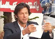 Imran Khan tearing his nomination paper at a press conference in 2007. It has been taken by the Administration of www.insaf.pk, who have allowed to use it.