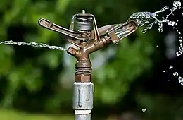 Image 5Impact sprinklerPhotograph: JJ HarrisonThe head of an impact sprinkler, a type of  irrigation sprinkler in which the sprinkler head, driven in a circular motion by the force of the outgoing water, pivots on a bearing on top of its threaded attachment nut. Invented in 1935 by Orton Englehardt, it quickly found widespread use.