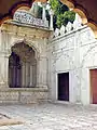 Interior of the mosque, with ornate carvings on marble surfaces