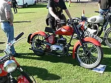 Photograph of Indian Brave motorcycle Model R (rigid frame) in red,