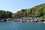 Wooden houses built on and above water.