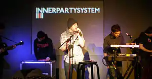 Innerpartysystem performing in 2009 at the Apple Store on Regent Street, London